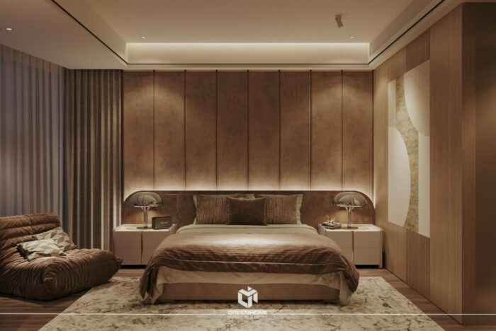 Thiết kế phòng ngủ tông gỗ nâu trầm sang trọng, thêm ghế sofa ngồi thư giãn.